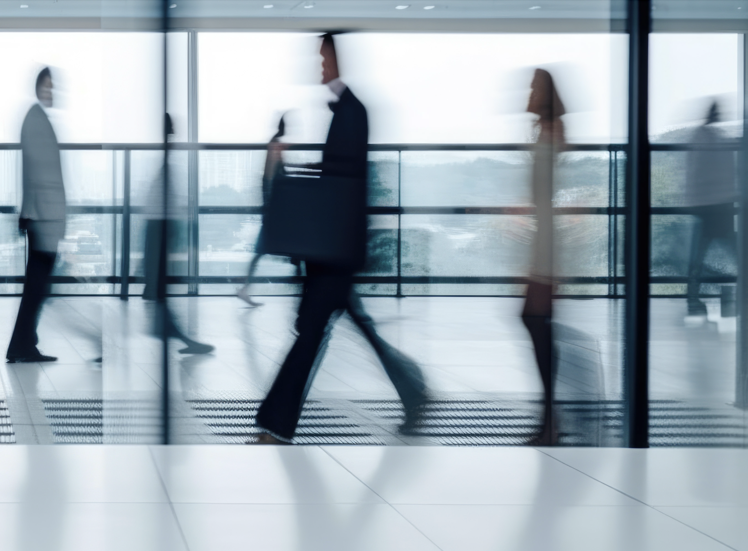 Business professionals walking with motion blur